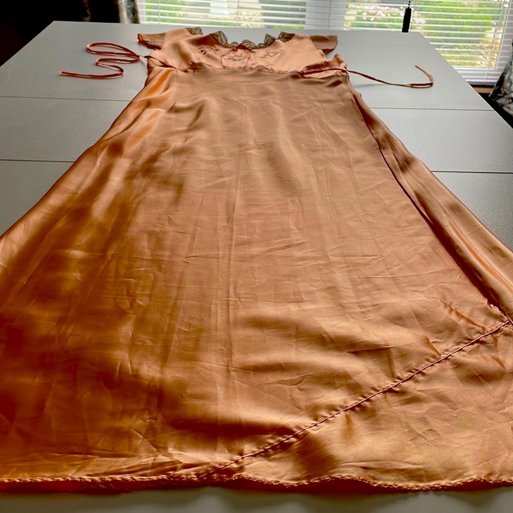 This is a vintage 1940s and homemade peach nightgown.